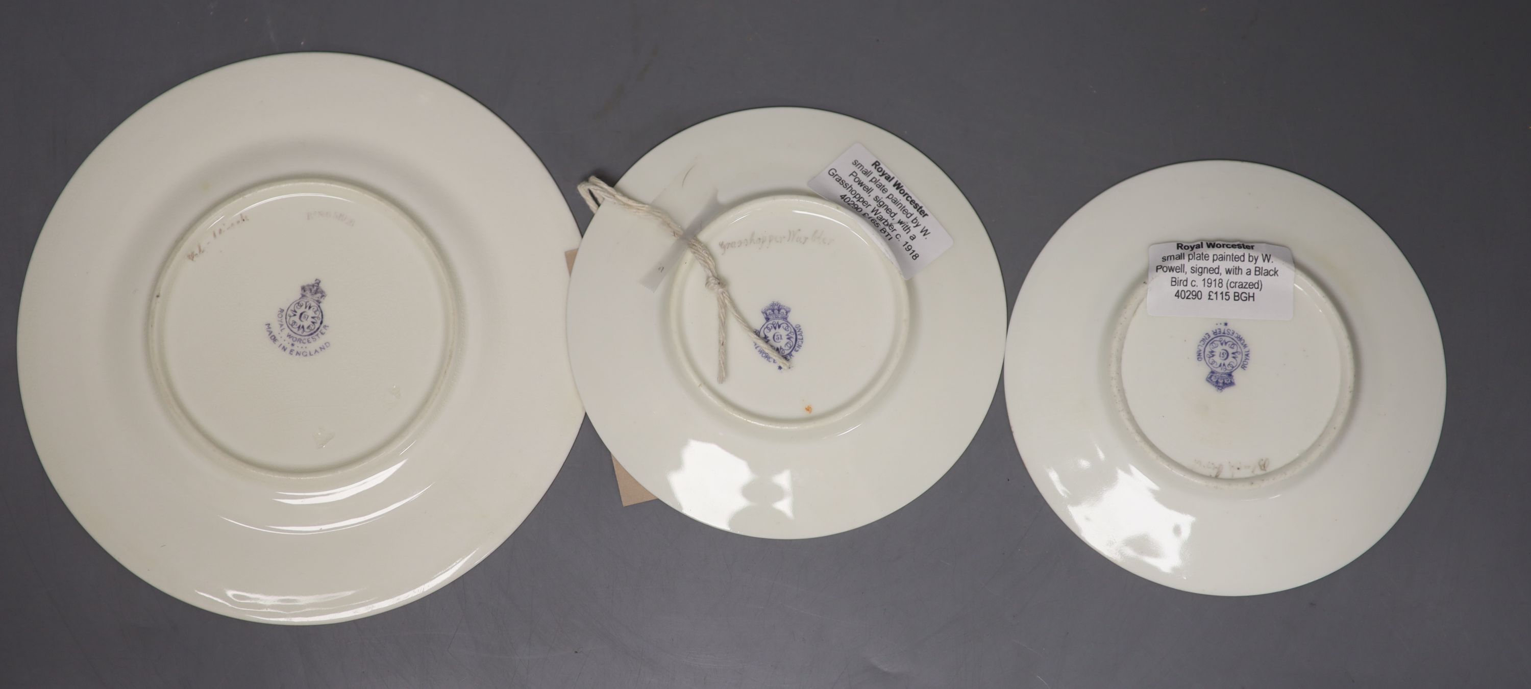 A pair of Royal Worcester plates and a single plate